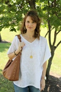 Casual spring outfit idea - White embroidered poncho, light denim, gold sandals from Secret Celebrity and a brown tassel handbag.