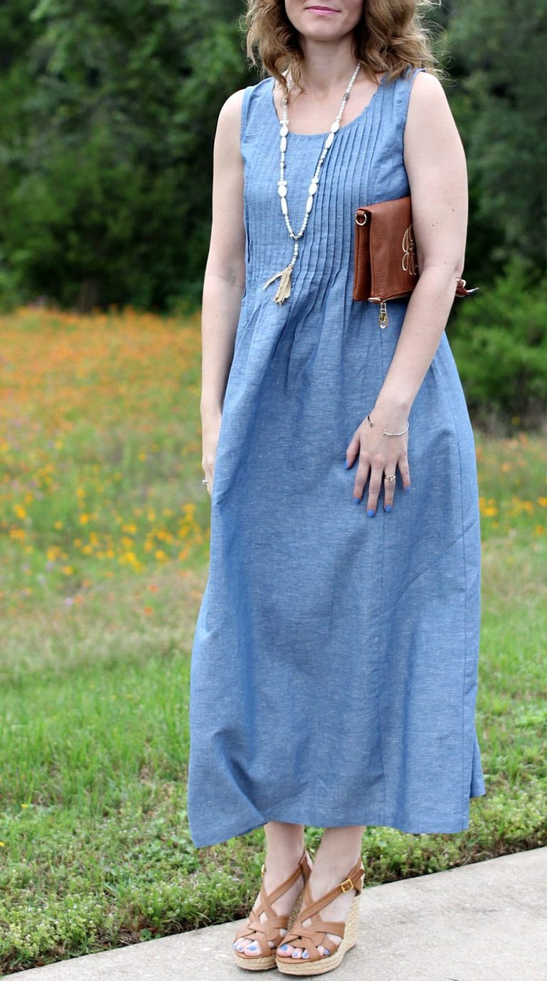 When it comes to the summer heat, a maxi dress is the perfect companion. This Chambray maxi dress features a pintucked waist, which helps this style to not come across as boxy and it gives your body some definition. You can go casual and wear it with a pair of wedge sandals or dress it up a bit and add strappy heels. The great feature about this maxi dress outfit is it doesn’t require much thought to put together a super cute summer outfit. When it comes to the summer heat, a maxi dress is the perfect companion. This Chambray maxi dress features a pintucked waist, which helps this style to not come across as boxy and it gives your body some definition. You can go casual and wear it with a pair of wedge sandals or dress it up a bit and add strappy heels. The great feature about this maxi dress outfit is it doesn’t require much thought to put together a super cute summer outfit.