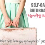 Closeup woman holding suitcase at white background. Tourism concept.