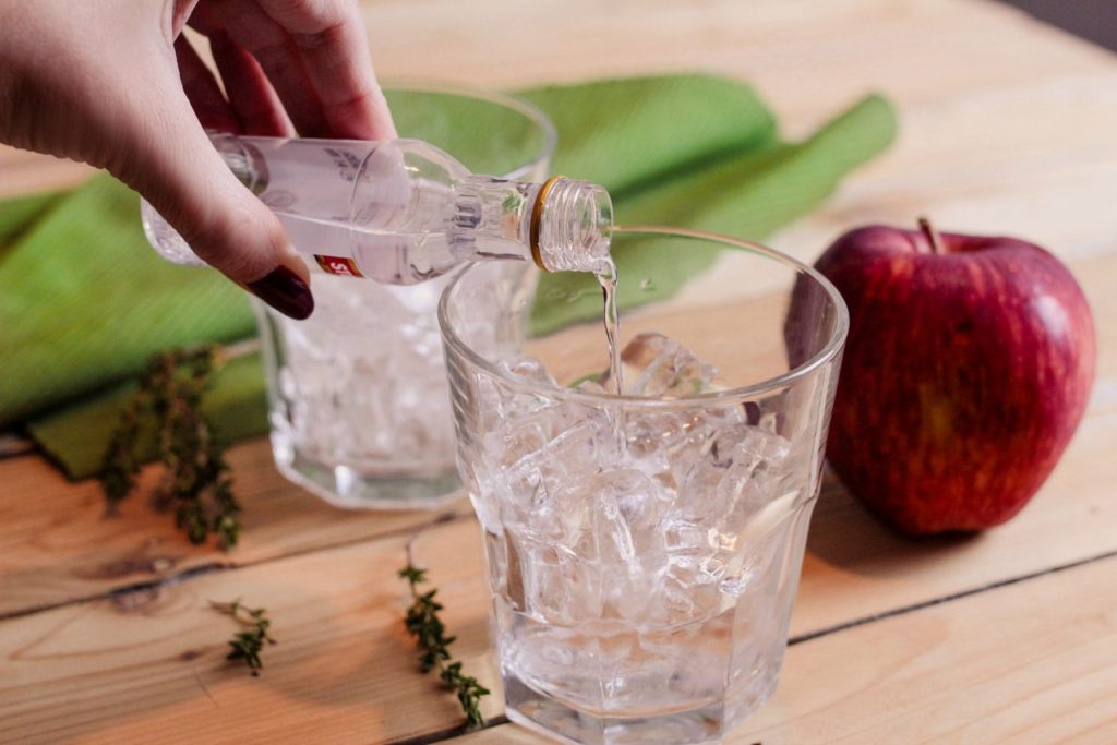 Adam's Apple Cocktail Recipe - This cocktail is super easy and very flavorful! Whether you're having a quiet night at home or want to impress friends, whip this up for a tasty drink to serve. It only requires 3 ingredients + the sprig of thyme and slice of apple which give it a great look.