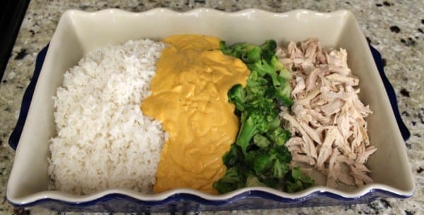 Looking for some easy rotisserie chicken recipes? This Cheesy Chicken, Broccoli & Rice Casserole is so easy to prepare for a weeknight meal. Just shred the chicken, add rice, broccoli and a special sauce and you're good to go. How does it taste? As good as it looks!