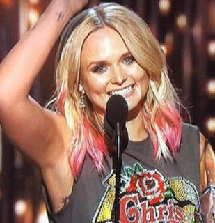 Get the look: Miranda Lambert's Hot Pink Hair. Hear from her stylist himself on how he achieved the pink streaks and both her red carpet and performance styles. 