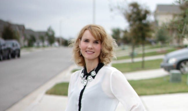 Black and white outfit idea - I styled a pair of black jeans with a white and black long sleeve shirt, burgundy bow flats and a statement necklace.