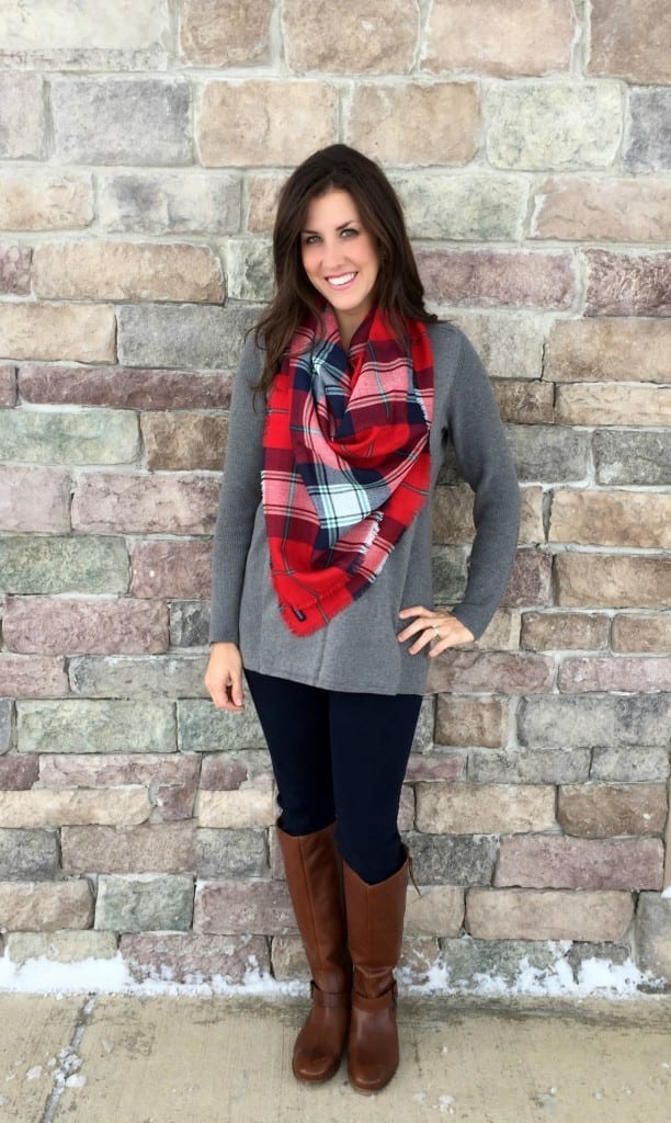 Christmas outfit ideas - wear a red plaid scarf with a comfortable shirt, jeans and  boots for a casual but stylish outfit.