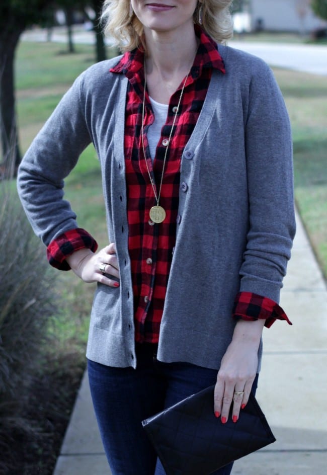 A casual and simple boyfriend cardigan outfit. Pair a red and black flannel with a neutral cardigan, jeans and booties for a great fall look.