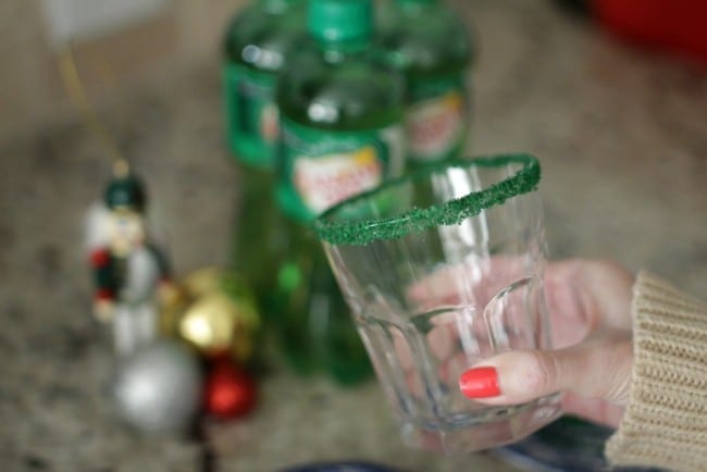 Grinch punch recipe - this punch is perfect for a Grinch viewing party. With its bright green color and deliciously sweet flavor and crunch from the sugar crystals, you can't go wrong. This might even make the Grinch smile.