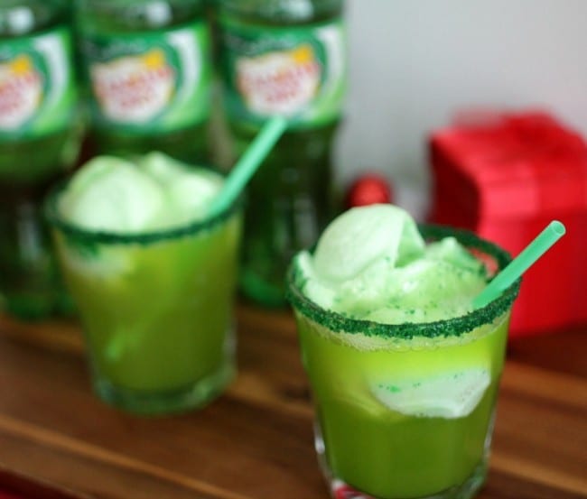 Grinch punch recipe - this punch is perfect for a Grinch viewing party. With its bright green color and deliciously sweet flavor and crunch from the sugar crystals, you can't go wrong. This might even make the Grinch smile. 