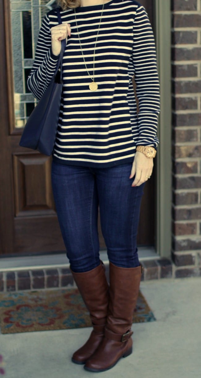 Casual Outfit idea - pair a striped shoulder-zipped pullover with your favorite jeans and riding boots.