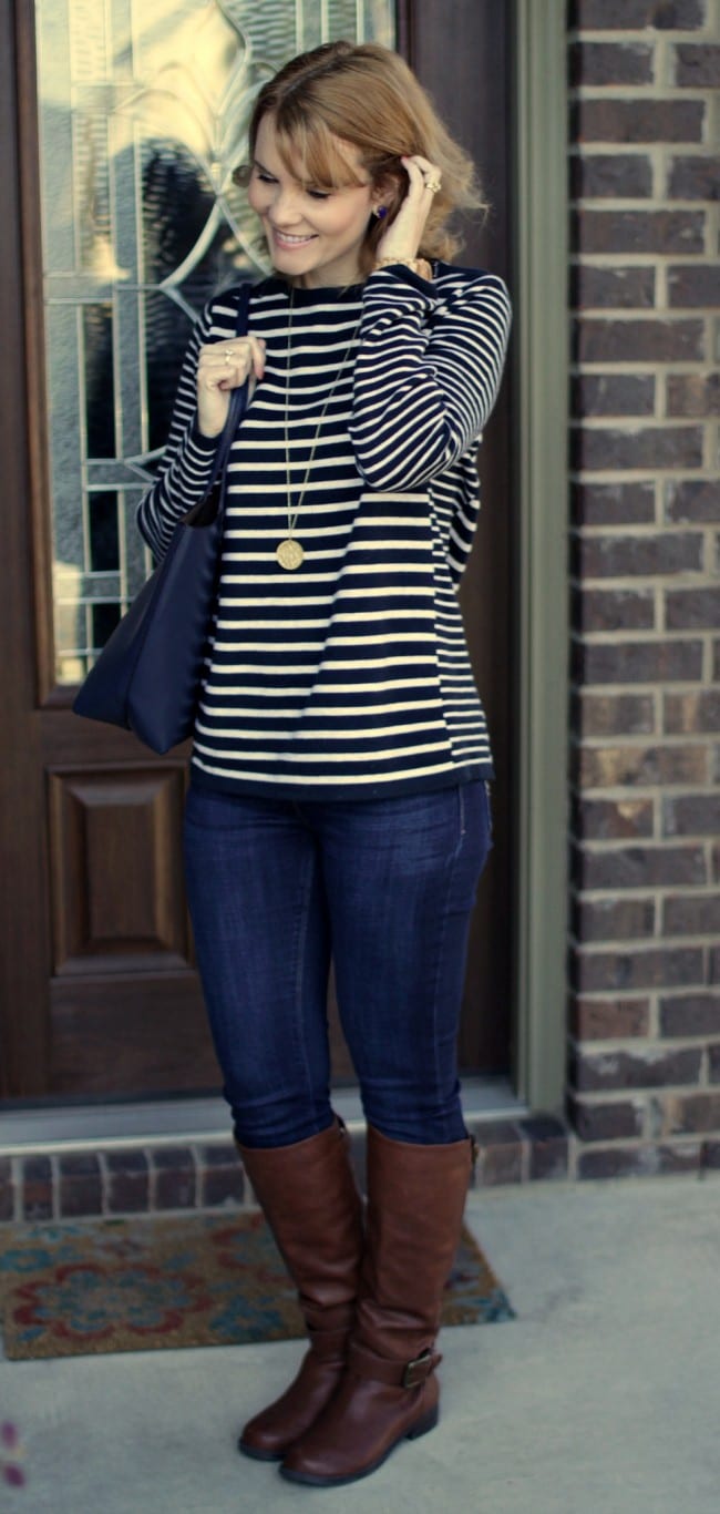 Casual Outfit idea - pair a striped shoulder-zipped pullover with your favorite jeans and riding boots.