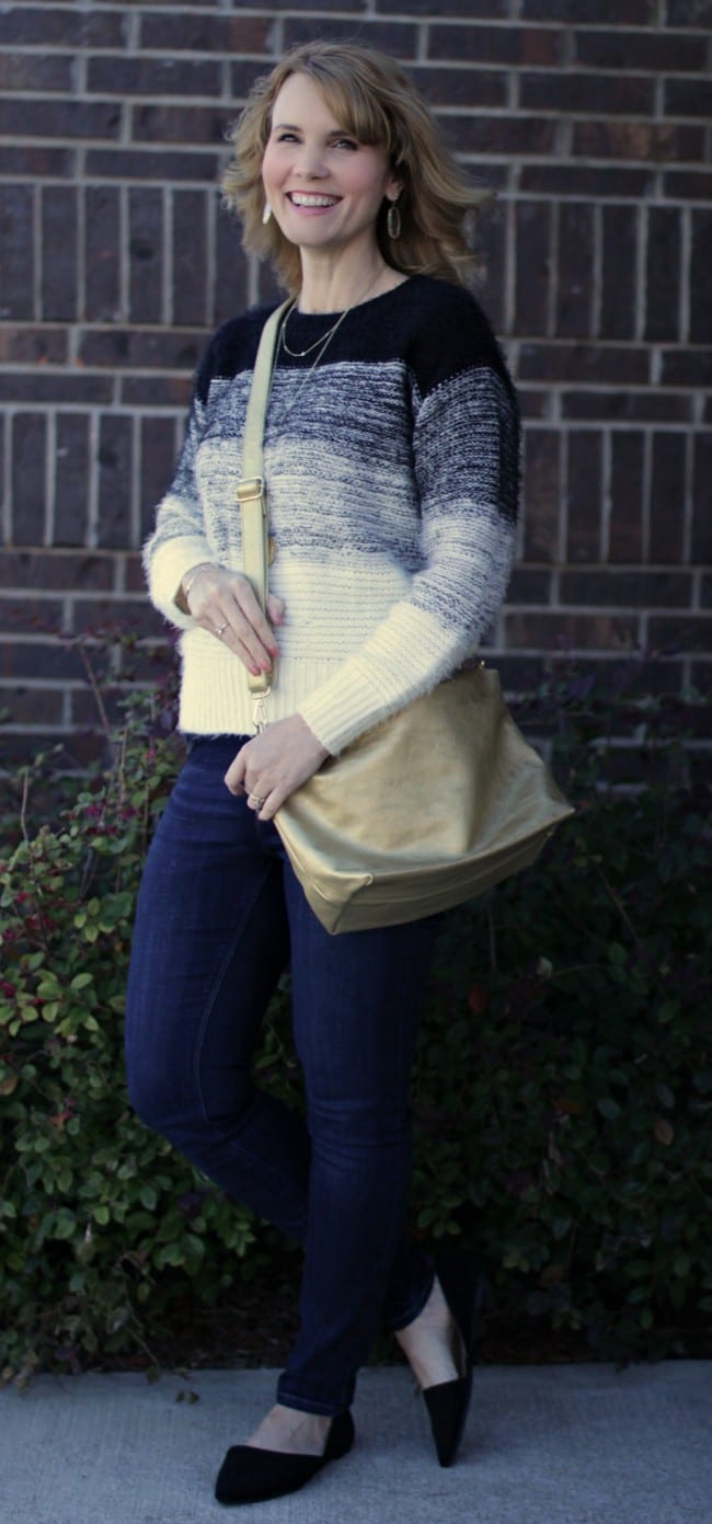 A gold purse is a nice accessory piece to add a little something extra to your outfit.