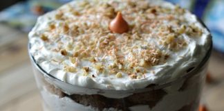 This Carrot Cake Cream Cheese Trifle features an important and tasty ingredient that will make your taste-buds dance -- Hershey's Kisses Carrot Cake Candy!