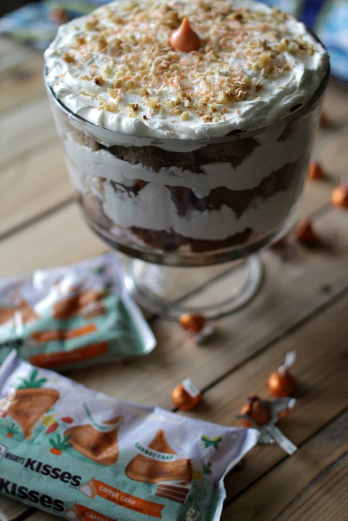 This Carrot Cake Cream Cheese Trifle features an important and tasty ingredient that will make your taste-buds dance -- Hershey's Kisses Carrot Cake Candy!
