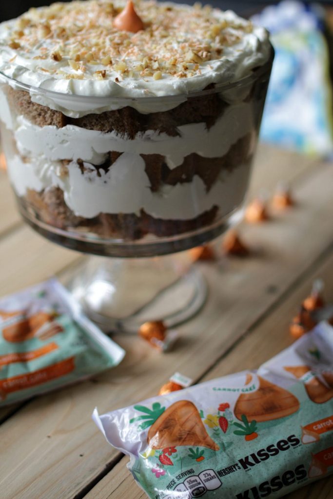 This Carrot Cake Cream Cheese Trifle features an important and tasty ingredient that will make your tastebuds dance -- Hershey's Kisses Carrot Cake Candy!