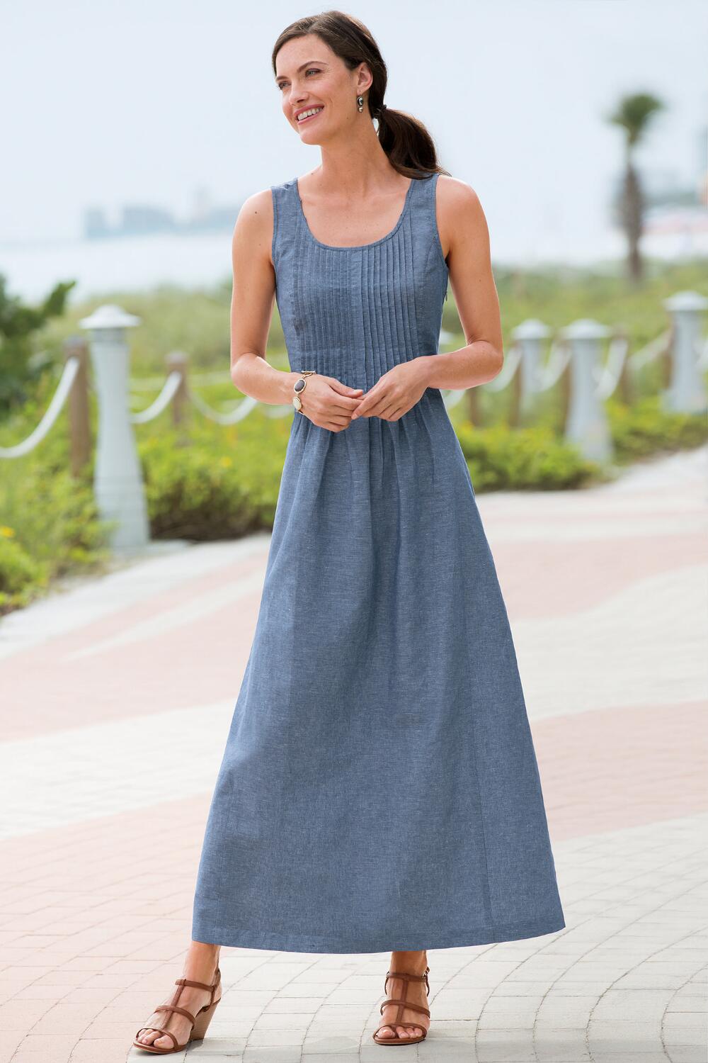 When it comes to the summer heat, a maxi dress is the perfect companion. This Chambray maxi dress features a pintucked waist, which helps this style to not come across as boxy and it gives your body some definition. You can go casual and wear it with a pair of wedge sandals or dress it up a bit and add strappy heels. The great feature about this maxi dress outfit is it doesn’t require much thought to put together a super cute summer outfit.