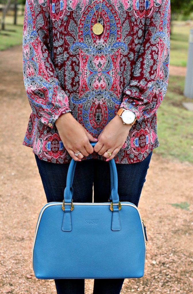 Women's Fall Outfit Ideas featuring a paisley print blouse, blue handbag and wedges.