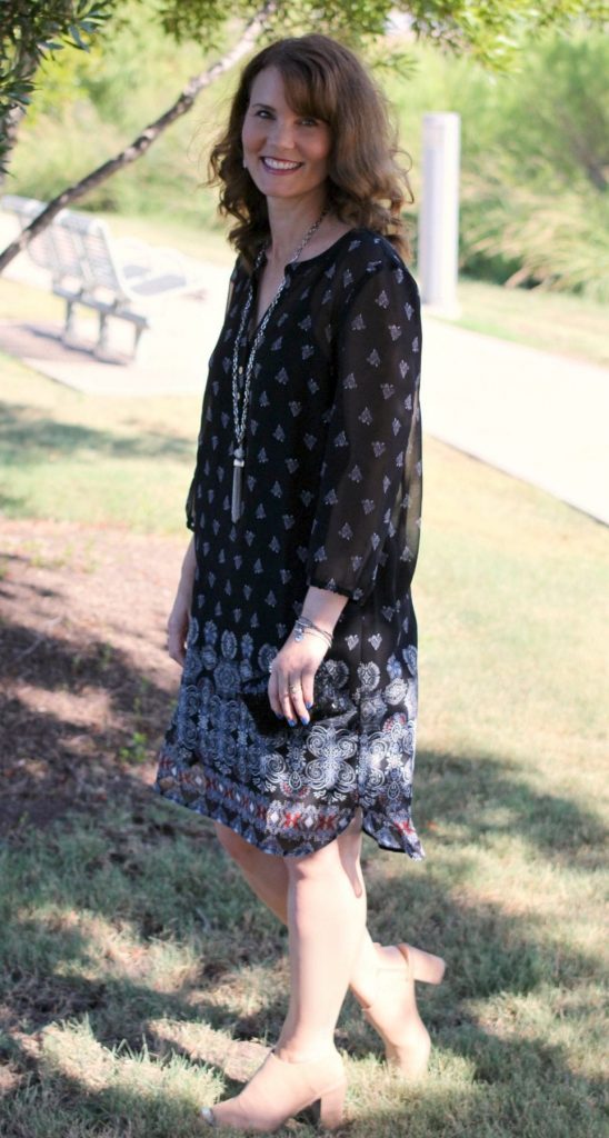 Outfit ideas for women: A pullover dress that's perfect for the summer to fall transition time. Pair it with ankle or peep toe booties and some accessories.