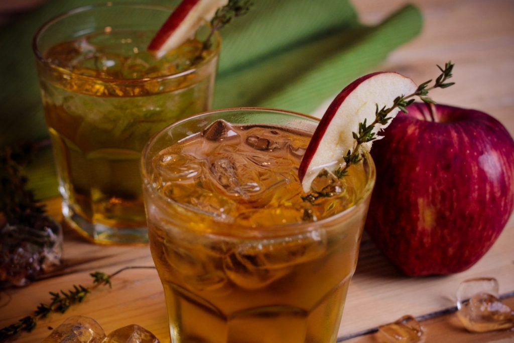 Adam's Apple Cocktail Recipe - This cocktail is super easy and very flavorful! Whether you're having a quiet night at home or want to impress friends, whip this up for a tasty drink to serve. It only requires 3 ingredients + the sprig of thyme and slice of apple which give it a great look.