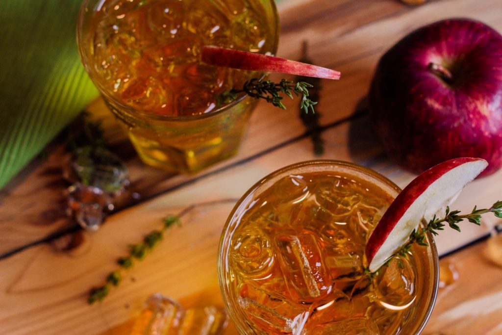 Adam's Apple Cocktail Recipe - This cocktail is super easy and very flavorful! Whether you're having a quiet night at home or want to impress friends, whip this up for a tasty drink to serve. It only requires 3 ingredients + the sprig of thyme and slice of apple which give it a great look.