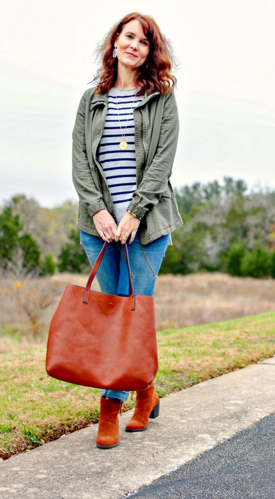 Stitch Fix outfit: Striped sweater, olive military style jacket, light wash denim, brown ankle boots and reversible tote.