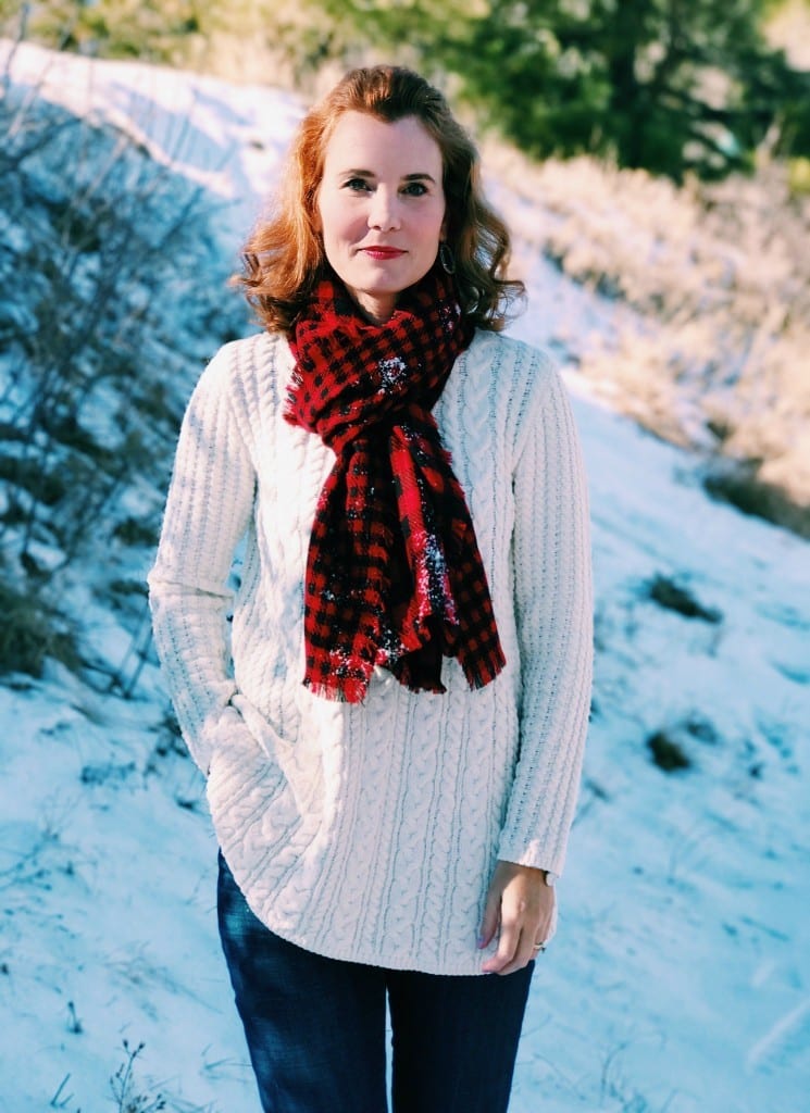 Christmas outfit idea: Ivory chenille sweater, buffalo plaid scarf, jeans and boots.