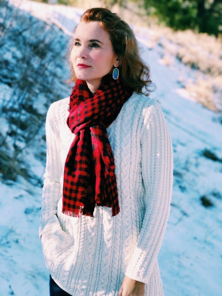 Christmas outfit idea: Ivory chenille sweater, buffalo plaid scarf, jeans and boots.