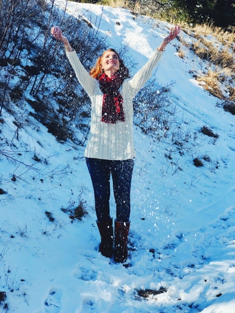 Christmas outfit idea: Ivory chenille sweater, buffalo plaid scarf, jeans and boots.