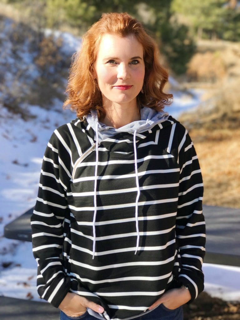 Casual weekend outfit - black and white striped sweatshirt, jeans and slip-on sneakers.