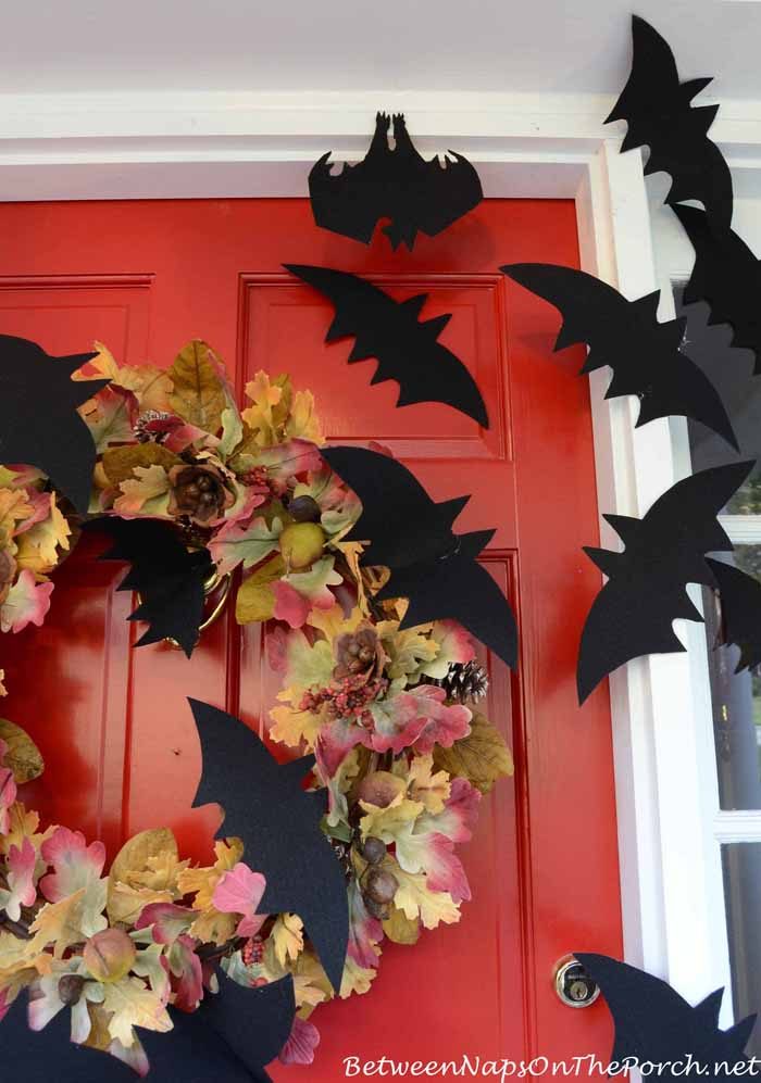 paper bats taped to a front door