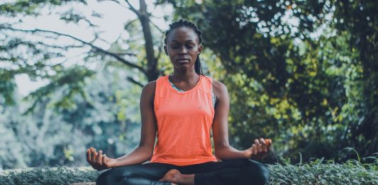 woman meditating 6 apps to destress